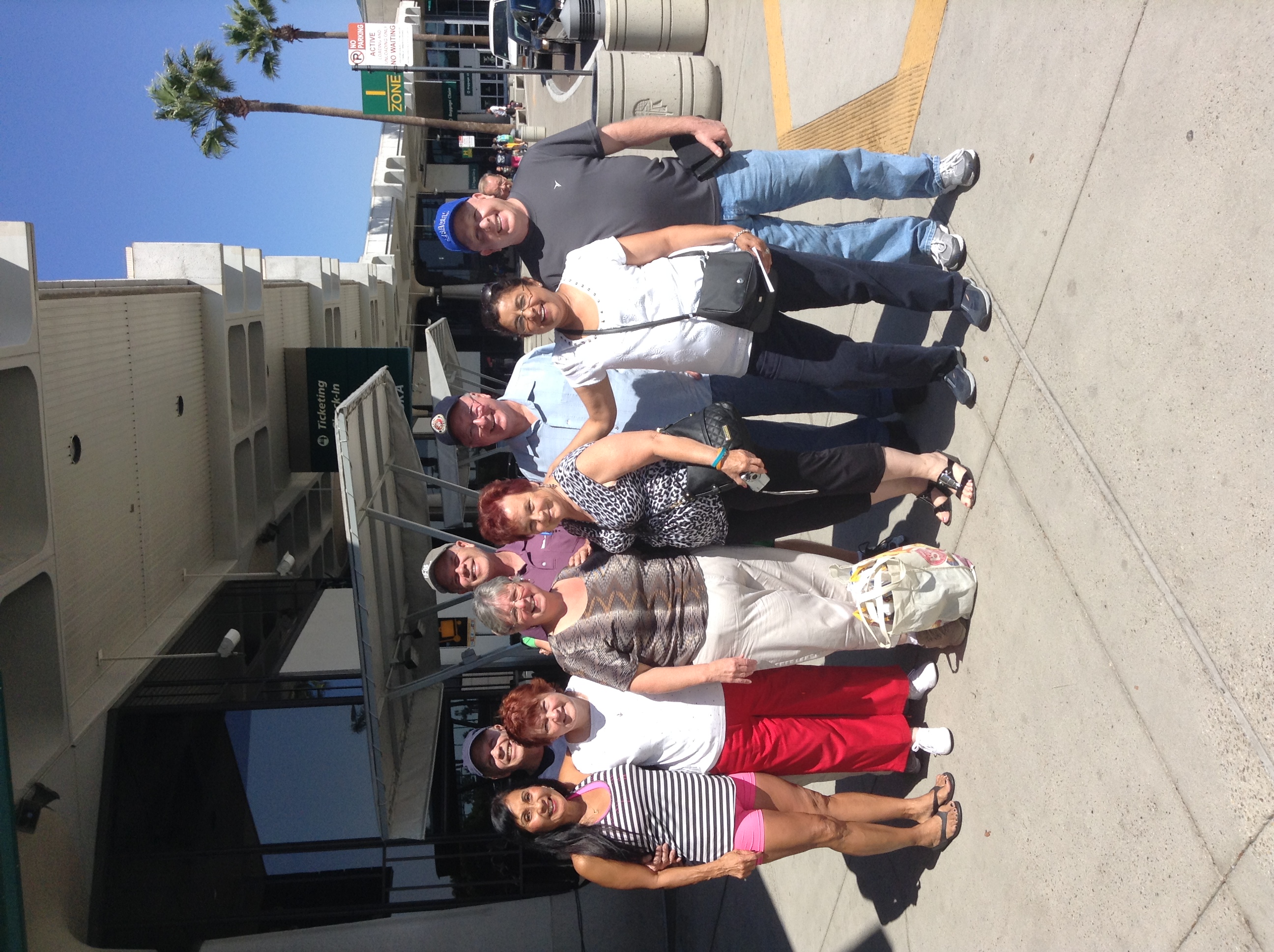 Large group of friends at an airport